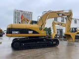 Гусеничний екскаватор 2010 Caterpillar 320CL, вигляд збоку