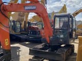 2019 Doosan DH55-V mini excavator, front three-quarter view