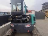 2015 Kobelco 55 mini excavator rear view with engine compartment open