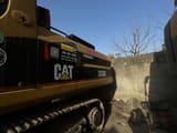 2010 Caterpillar 325BL crawler excavator side profile view