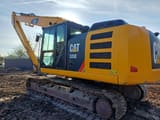 2012 Caterpillar 320E crawler excavator, rear three-quarter view
