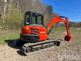 2023 Kubota KX057-4 crawler excavator, rear three-quarter view