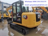2023 Caterpillar 305.5E2 crawler excavator, rear three-quarter view