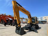 2022 Hyundai R210W-9 wheel excavator, front three-quarter view