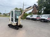 1995 Schaeff HR 12 mini excavator, side view