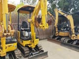 2023 Komatsu PC18MR-3 mini excavator, front three-quarter view
