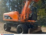 2011 Caterpillar M318D wheel excavator, side profile view