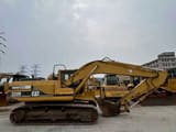 2000 Caterpillar 320B crawler excavator, side view