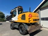 2014 Liebherr A916 wheel excavator, rear three-quarter view