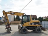 2003 Caterpillar M313C wheel excavator, side view