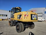 2011 Caterpillar M322D wheel excavator, rear three-quarter view