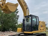 2024 Caterpillar 320GC crawler excavator, front three-quarter view