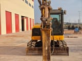 2019 JCB 85Z mini excavator, front view with hydraulic breaker attachment