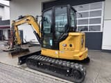 2024 Caterpillar 305 CR mini excavator, rear three-quarter view