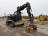 2023 Yanmar B95W excavator, front three-quarter view