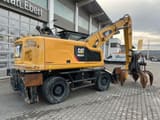 2018 Caterpillar MH3024 material handler, rear three-quarter view