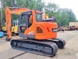 2018 Doosan DX140LCR-5 crawler excavator, rear three-quarter view