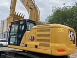 2024 Caterpillar 320GC crawler excavator, rear three-quarter view