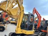 2024 Komatsu PC-55MR mini excavator, front three-quarter view