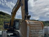2015 Caterpillar 349EL crawler excavator, front view with bucket