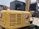2024 Caterpillar 306E2 excavator, rear three-quarter view
