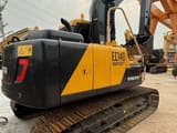 2025 Volvo EC140 crawler excavator, rear three-quarter view