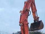 2006 Hitachi ZX130 crawler excavator, side view of boom and bucket