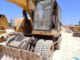 2016 Caterpillar M320F wheel excavator, front three-quarter view