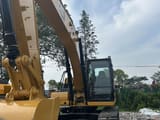 2020 Caterpillar 320GC crawler excavator front three-quarter view