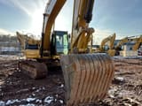 2021 Caterpillar 320GC crawler excavator, front view with bucket