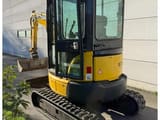 2017 Komatsu PC26MR-3 mini excavator, rear three-quarter view