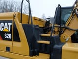 2019 Caterpillar 320 crawler excavator side view of cab and engine housing