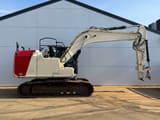 2012 Caterpillar 316EL crawler excavator, side view