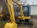 2015 Komatsu PC55MR-2 mini excavator, front three-quarter view