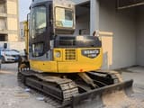 2023 Komatsu PC78US excavator, rear three-quarter view