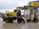 2012 Caterpillar M313D wheel excavator side view