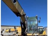 2009 Caterpillar M318D wheel excavator, front three-quarter view