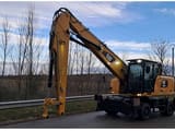 2020 Caterpillar MH3024-1 wheel excavator, front three-quarter view