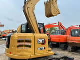 2024 Caterpillar 307E2 mini excavator, rear three-quarter view