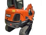 2023 Doosan DX60LC-9C crawler excavator, rear three-quarter view
