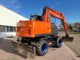 2011 Hitachi ZX140W-3 wheel excavator, rear three-quarter view