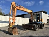 1997 Caterpillar M315 wheel excavator, side view