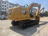 2023 Caterpillar 320GC crawler excavator, rear three-quarter view
