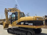 2019 Caterpillar 320C excavator, rear three-quarter view