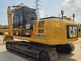 2023 Caterpillar 323D2L crawler excavator, rear three-quarter view