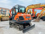 2022 Doosan DX60 crawler excavator, rear three-quarter view