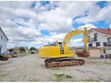 Komatsu PC210LC-10 crawler excavator, rear three-quarter view
