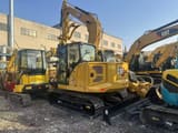 Caterpillar 307.5 crawler excavator, rear three-quarter view