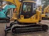 2023 Komatsu PC128US crawler excavator, side profile view