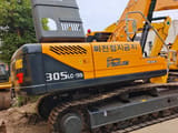 2024 Hyundai 305LC-9S crawler excavator rear three-quarter view